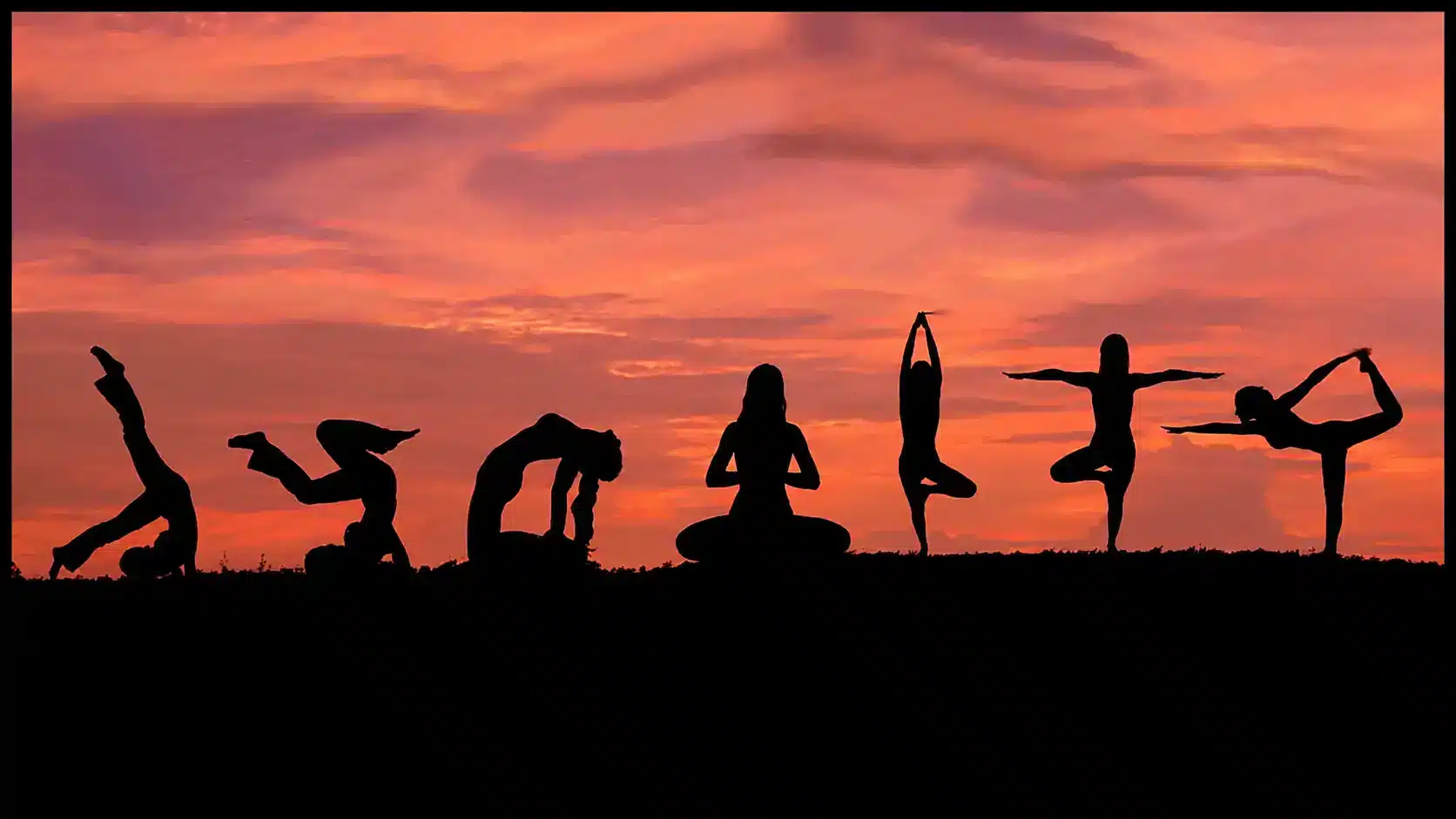 Seven silhouettes practicing yoga poses against an orange-pink sunset, surrounded by a black frame.